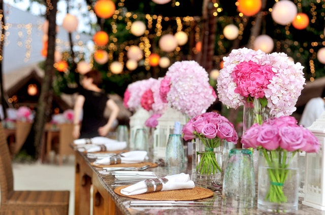 table-with-plates-and-flowers-filed-neatly